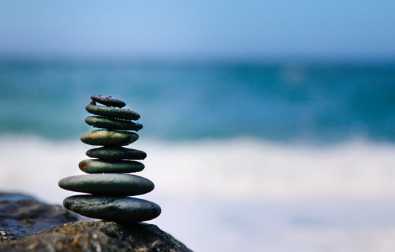 Zen art of Rock balancing set against an out-of-focus Pacific Ocean. When balancing stones the mind becomes focused and quiet. It’s a meditative practice. 