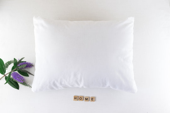 Blank white pillowcase mock up with purple flowers and home letters