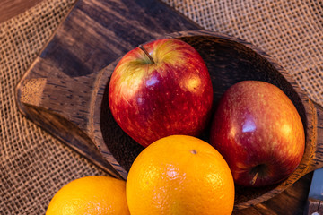 oranges and apples on a table