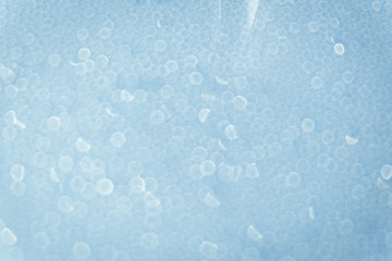 Abstract of bokeh light from water drops on the mirror background.