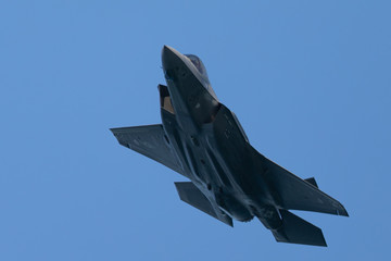 Bottom view of an F-35 Lightning II  approaching in beautiful light