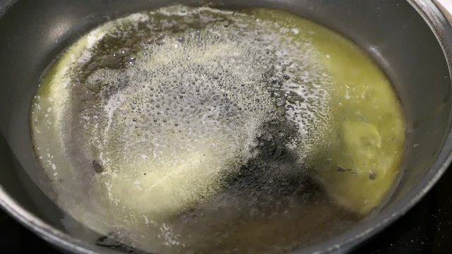 Melting Butter In A Pan To Bake Pancakes.