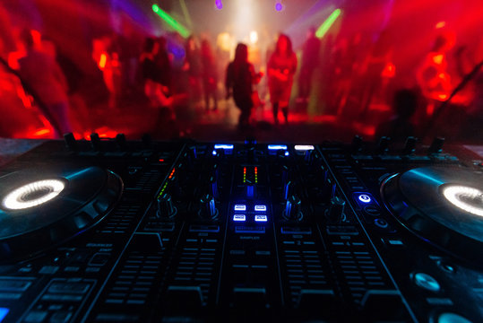 professional DJ mixer controller for mixing music in a nightclub