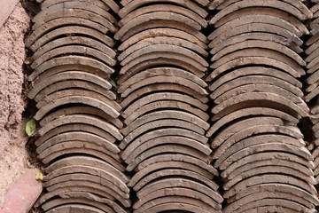 Stack of new roof tile at Tianshui Wushan Water Curtain Caves, Gansu China.