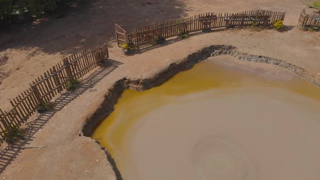 Revealing aerial of a cone shaped mud volcano in bunsee trace penal on the Caribbean island of Trinidad and Tobago