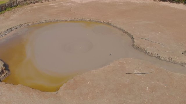 Bunsee Trace mud volcano aerial footage of mud bubbling up from the center of this wet type volcano in Penal, Trinidad
