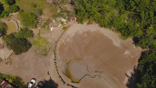 Birds eye view of Bunsee Trace Mud Volcano located in the dense tropical rain forest in Penal, Trinidad and Tobago