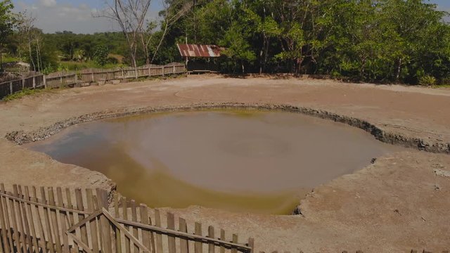 L'eau Michel mud volcano is a wet type volcano with mud rising in the form of bubbles and then flowing down the sides of the cone
