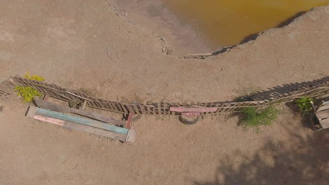 Ascending aerial of a cone shaped mud volcano located in bunsee trace penal, Trinidad and Tobago