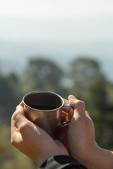 drinking Dripping Coffee at camp with nature
