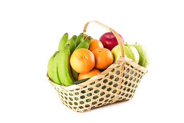 madarin orange, guava fruit, banana and red apple in gift basket on white background fruit health food isolated