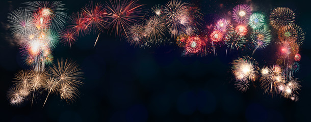 colorful fireworks on the black sky background with free space for text. Celebration and anniversary concept