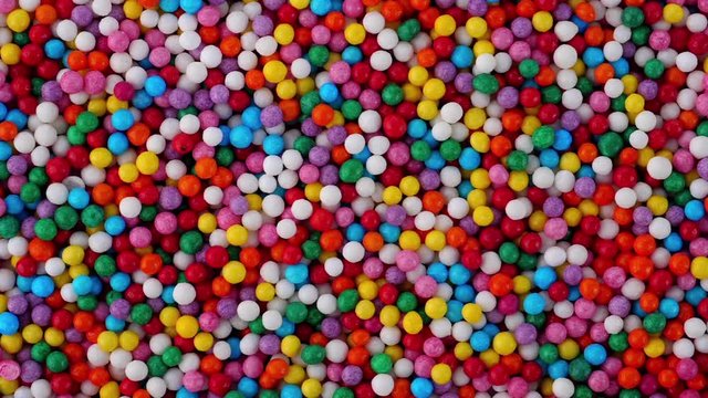 Colorful sprinkles sugar candy fly after being exploded in blender. Close-up shot.