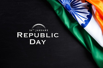 Fototapeta na wymiar Indian republic day concept. Indian flag with the text Happy republic day against a blackboard background. 26 January.