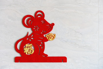 a fluffy paper-cut as symbol of Chinese New Year of the rat stuck to the wall the Chinese means fortune