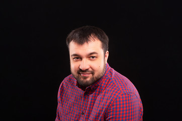 Portrait of a happy bearded man.