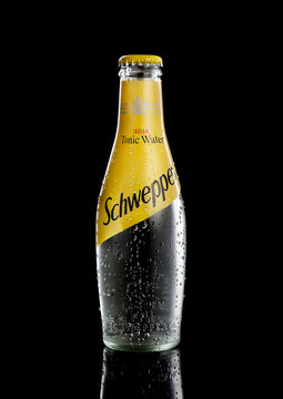 POLTAVA, UKRAINE, JANUARY 8, 2020: Schweppes  glass bottle isolated on black background