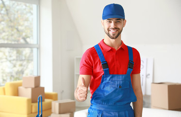 Loader showing thumb-up in flat on moving day