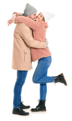 Portrait of happy couple in winter clothes on white background