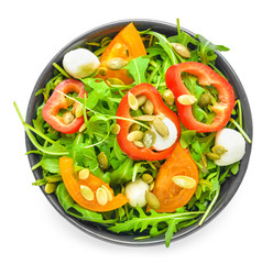 Plate with tasty salad on white background