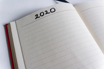 New Years concept, 2020 text on new leaf of a book. New beginning.