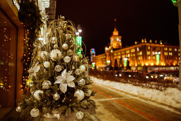 Christmas tree with lights outdoors at night in Kiev. Sophia Cathedral on background. New Year...