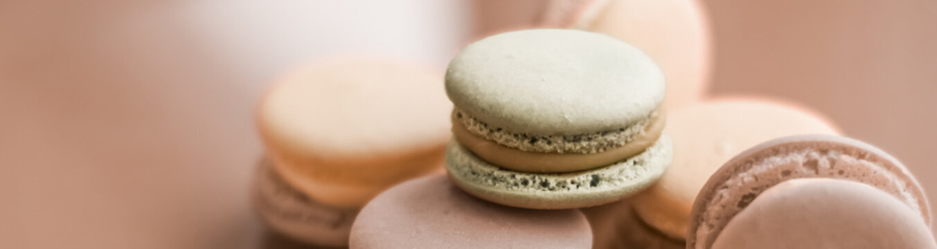 French macaroons on cream beige background, parisian chic cafe dessert, sweet food and cake macaron for luxury confectionery brand, holiday backdrop design