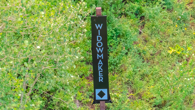Panorama Hiking trails in Park City with signage against trees and leaves at off season