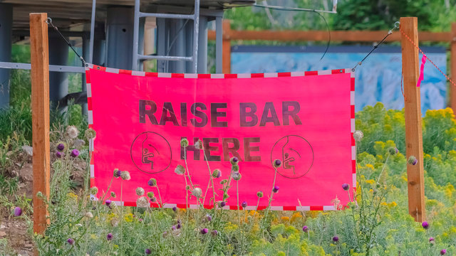 Panorama Frame Raise Bar Here Sign Against Chairlift Station In Park City Utah At Off Season