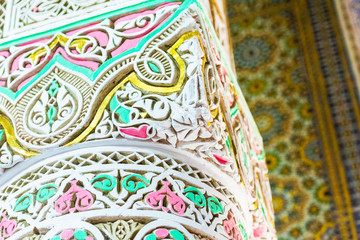 Carved ornamental columns in the city of Fes, Morocco. With selective focus.