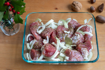 Pieces of sliced meat and marinated with onions
