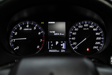 Close up Instrument automobile panel with Odometer, speedometer, tachometer, fuel level.