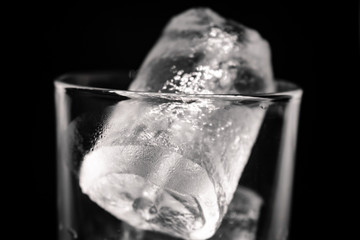 glass of water with ice on a background