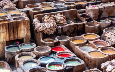 Dye reservoirs and vats in traditional tannery of city of Fez, Morocco.