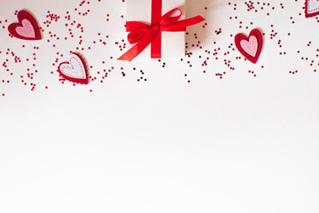 Gift white box with beautiful red ribbon and hearts Concept of Valentine's Day or birthday