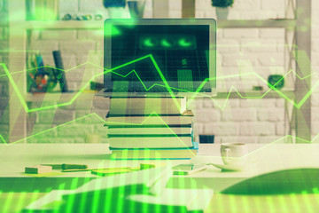 Financial graph colorful drawing and table with computer on background. Double exposure. Concept of international markets.