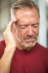 Mature man having a headache stock photo