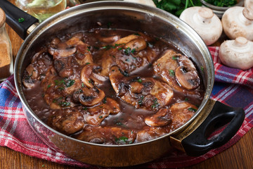 Delicious chicken marsala on frying pan