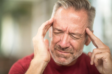 Mature man having a headache stock photo