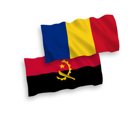 National vector fabric wave flags of Romania and Angola isolated on white background. 1 to 2 proportion.