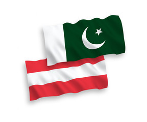 Naklejka premium National vector fabric wave flags of Austria and Pakistan isolated on white background. 1 to 2 proportion.