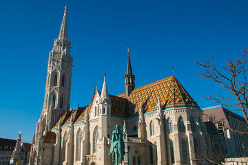 View of Matthias church in Buda Castle district on blue sky, built at the heart of Buda's Castle District, Budapest, Hungary 