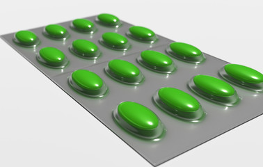 Packing with colored pills on a white background close-up.