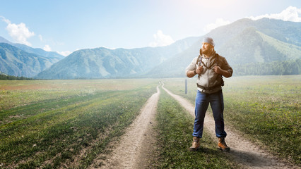 Obraz premium Hiker man in mountains. Mixed media