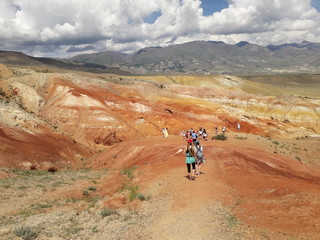 Fototapeta premium Tourists in the Martian valley in the Altai mountains in southern Siberia in Russia.
