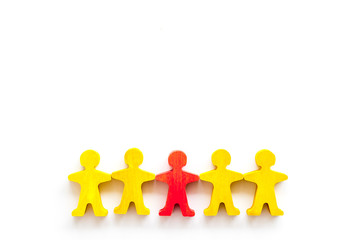 Leader concept. People cutuots - red figure against others on white background top-down copy space
