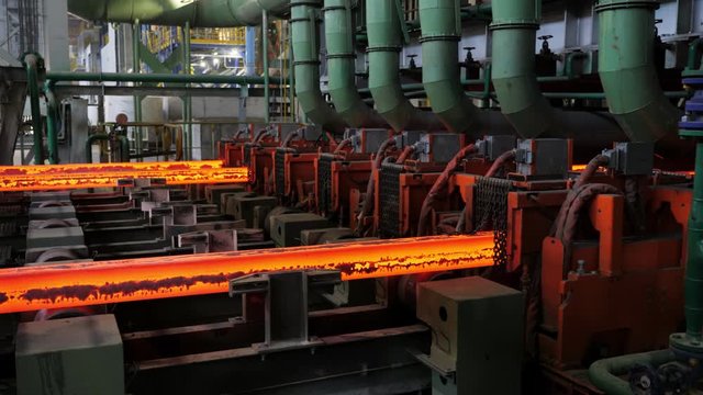 Iron foundry. Continuous casting machine. The workpiece moves along the conveyor