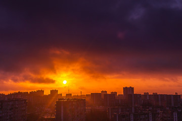 Morning sunrise over the city residential houses