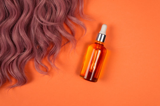 Hair Oil On Orange Background.