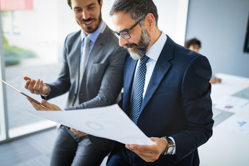 Business people having fun and chatting at workplace office